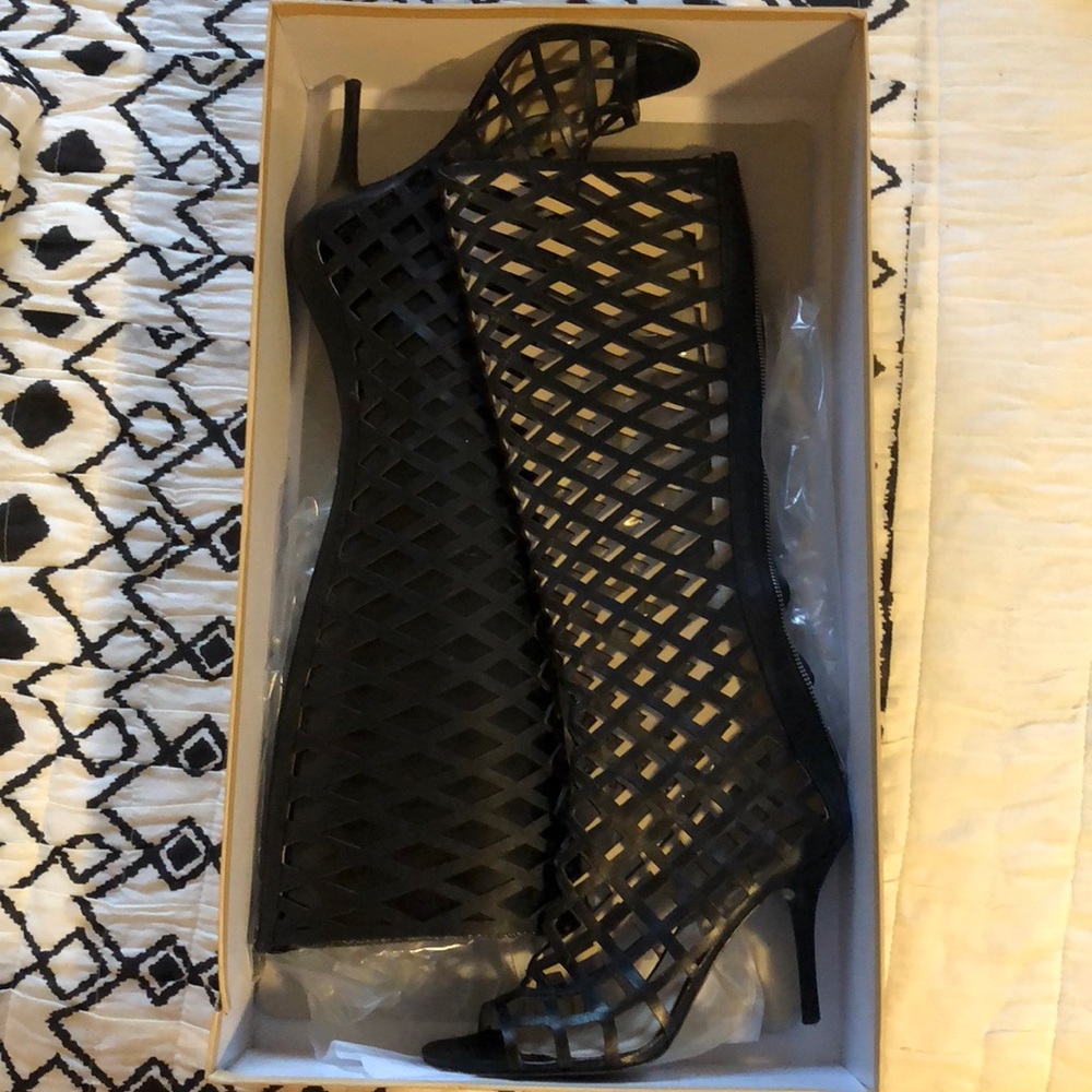 Black Michael Kors over-the-knew heels.